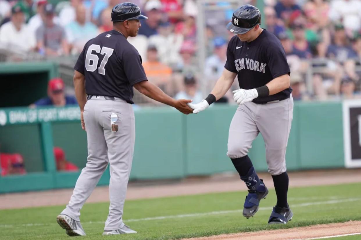 An image collage containing 1 images, Image 1 shows New York Yankees first baseman Ben Rice (22) is congratulated by third base coach Luis Rojas (67)
