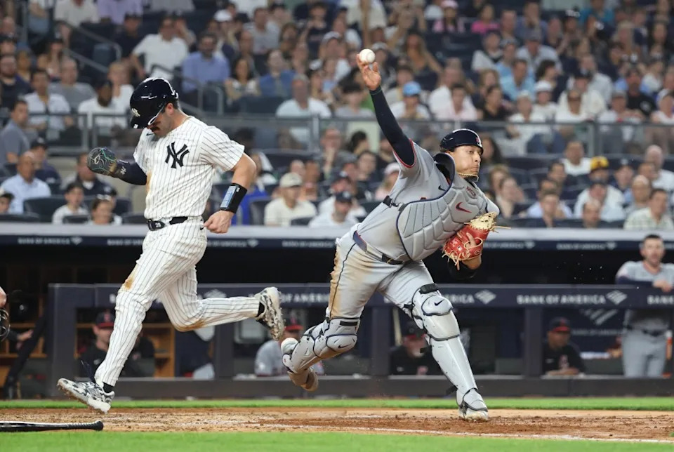 Austin Wells of the New York Yankees is forced out at home plate as Bo Naylor of the Cleveland Guardians completes a double play on a ball hit by Ben Rice of the New York Yankees with the bases loaded during the fifth inning. Charles Wenzelberg / New York Post