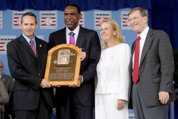 Hall of Fame inductee Andre Dawson with Hall of Fame President Jeff Idelson, left, Chairman Jane Forbes Clark and MLB Commissioner Bud Selig during the Baseball Hall of Fame induction ceremony in Cooperstown, N.Y., on Sunday, July 25, 2010. (AP Photo/Mike Groll)