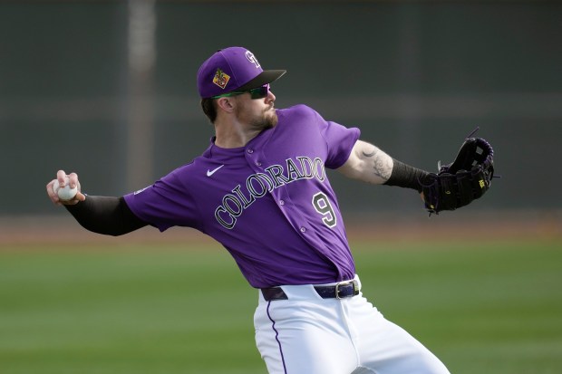 Colorado Rockies' Brenton Doyle works out during spring training on Tuesday, Feb. 17, 2026, in Scottsdale, Ariz. (AP Photo/Ross D. Franklin)