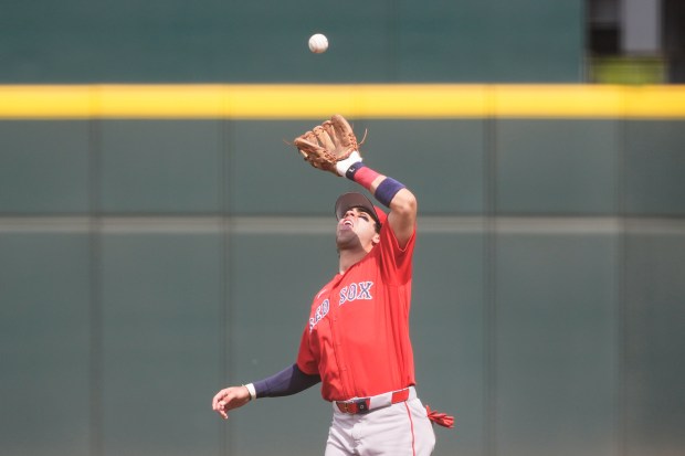 Boston Red Sox second baseman Marcelo Mayer fields a fly out by Atlanta Braves Austin Riley to end the first inning of a spring training game in North Port, Fla., Friday, Feb. 27, 2026. (AP Photo/Gerald Herbert)