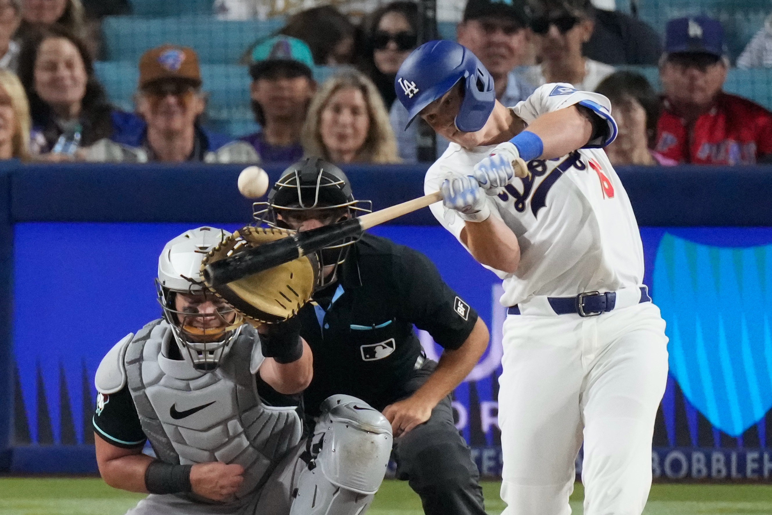 Dodgers’ Will Smith, right, hits a two-run home run as...