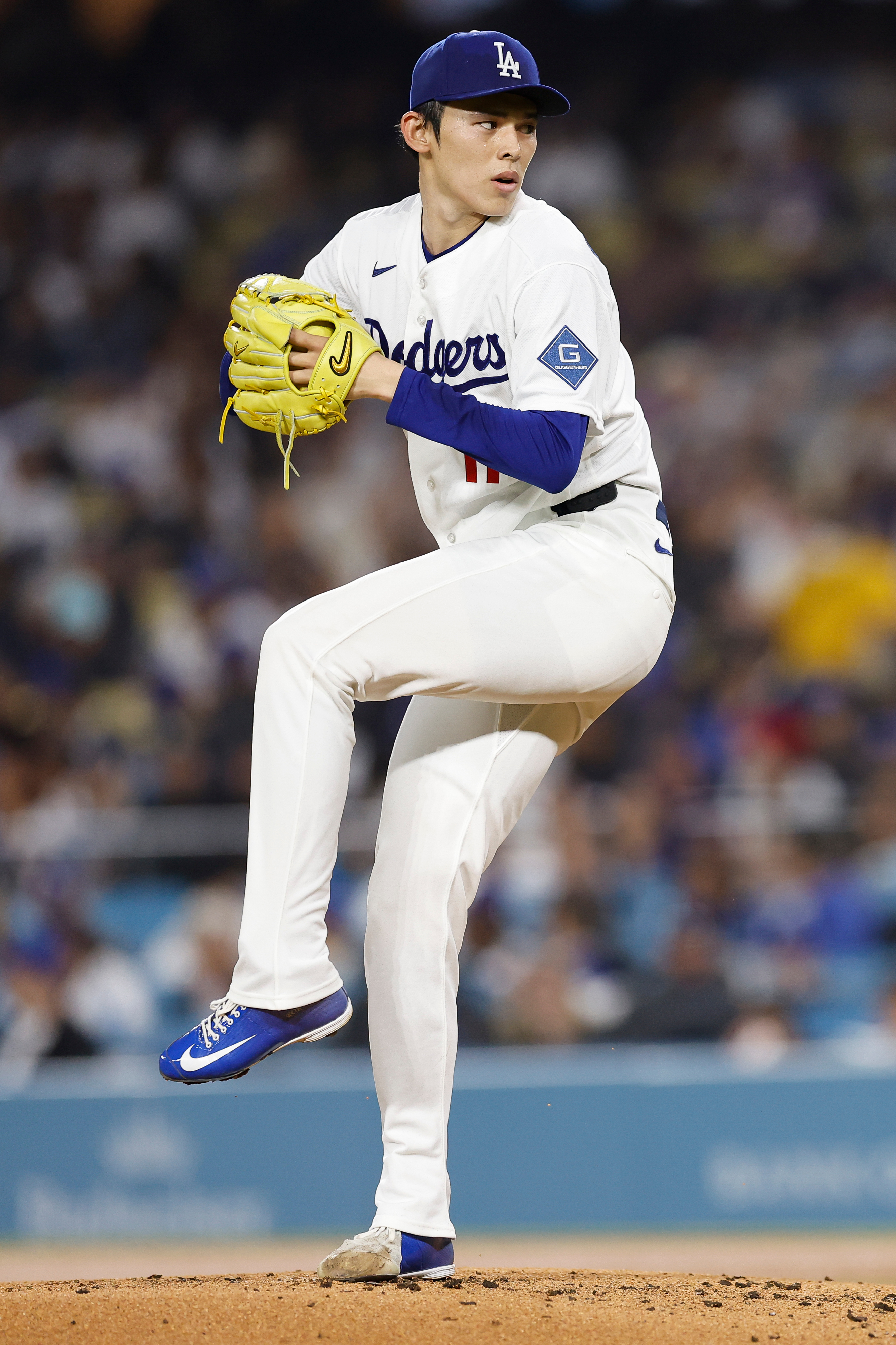 Dodgers starting pitcher Roki Sasaki throws to the plate during...