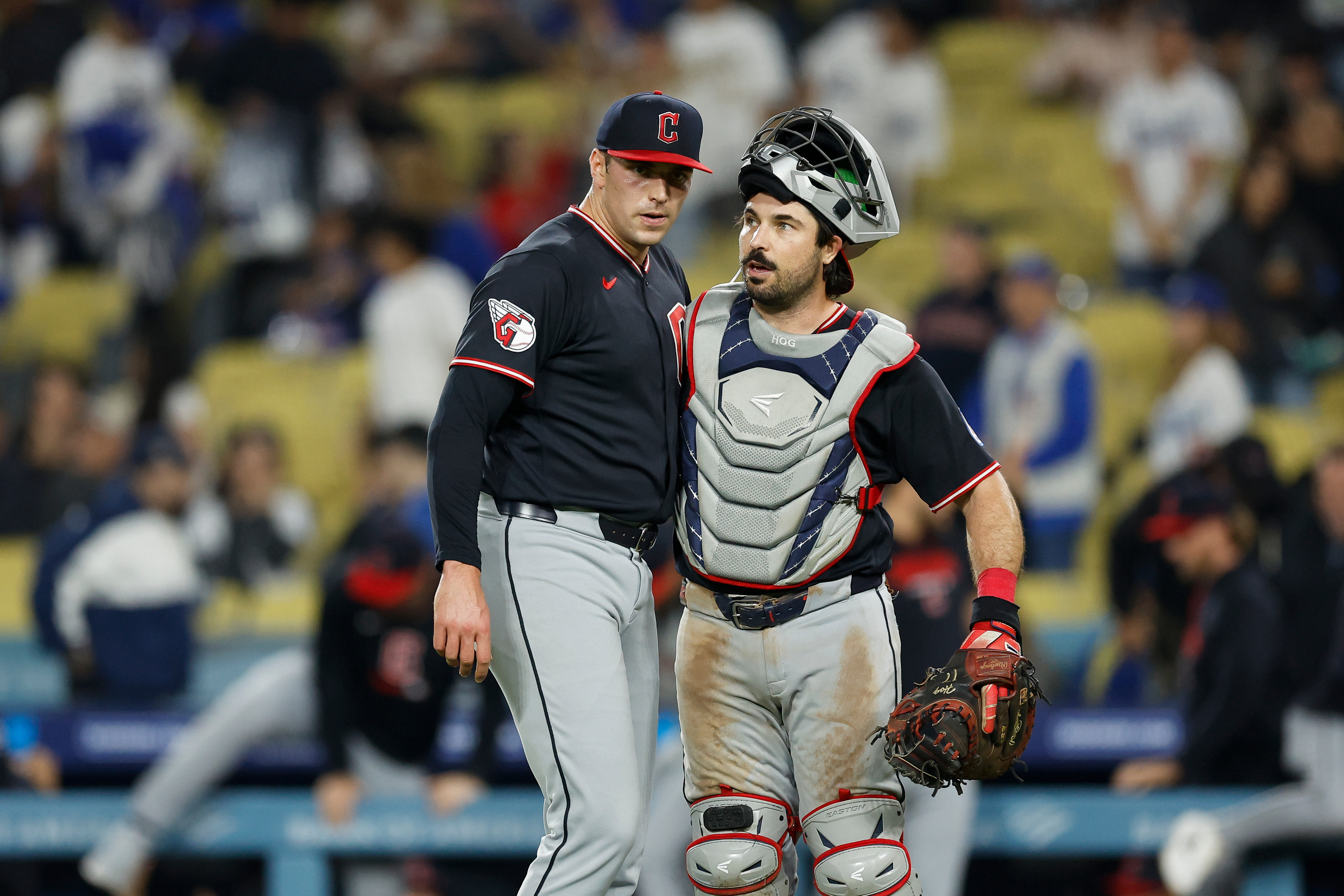 Cleveland Guardians relief pitcher Cade Smith, left, and catcher Austin...