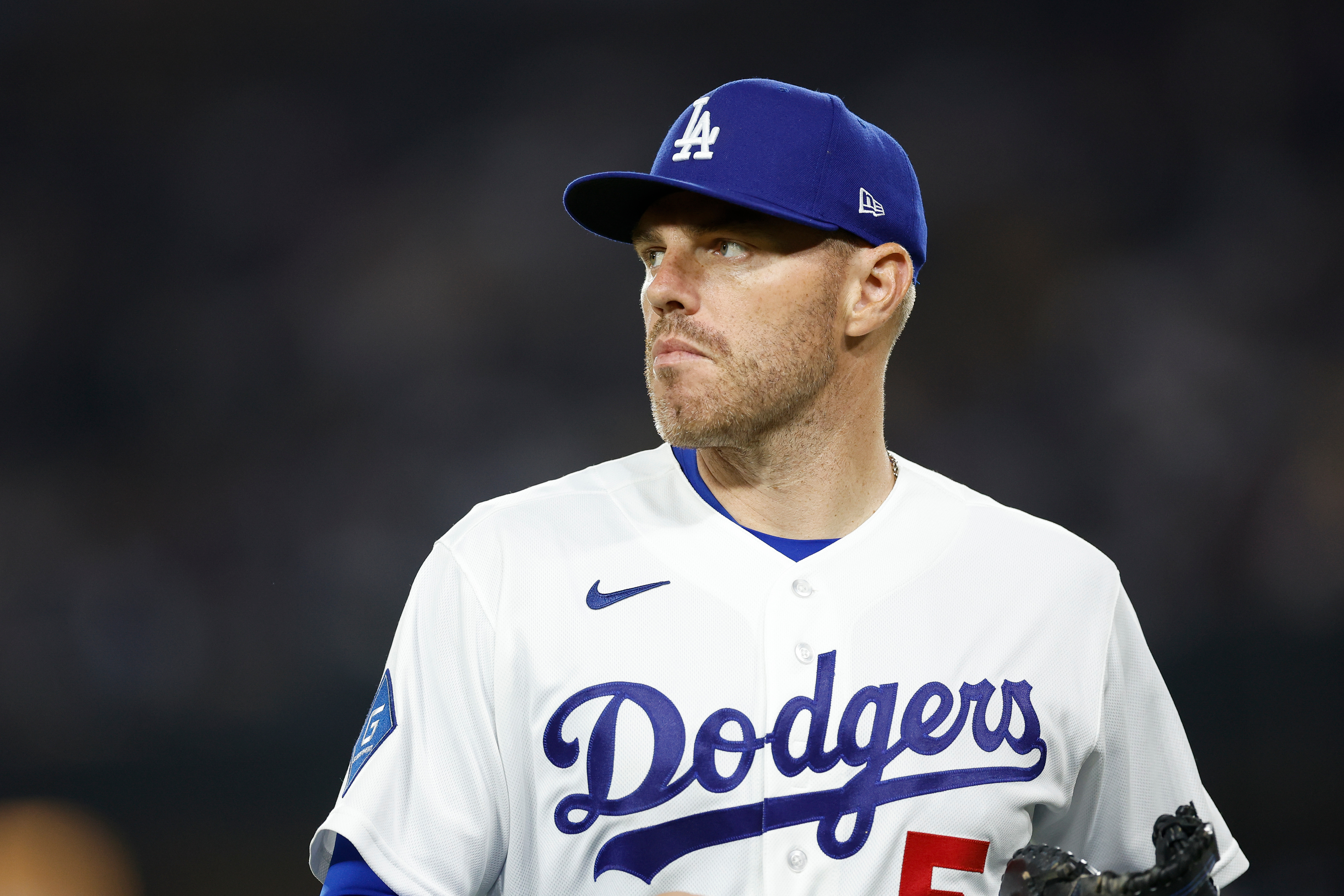 Dodgers first baseman Freddie Freeman walks off the field after...