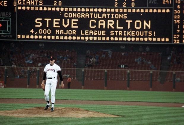 San Francisco Giants pitcher Steve Carlton stands on the pitchers mound as the billboard behind him flashes his 4,000th major league career strikeout during the Giants' night game against the Cincinnati Reds in San Francisco, Ca., Aug. 6, 1986. The Giants lost the game, 11-6. (AP Photo/Bill Beattie)