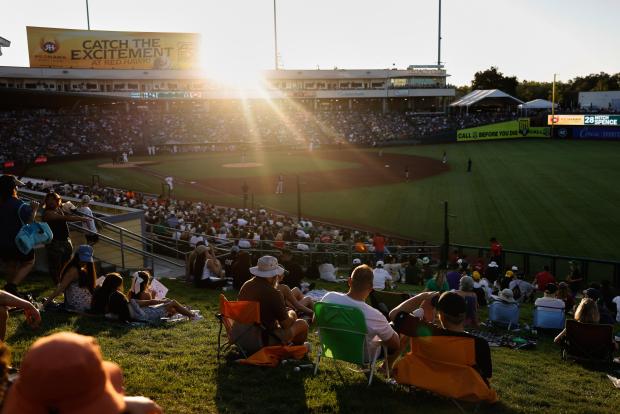FILE - Fans watch from the outfield seats during the fourth inning of a baseball game between the Atlanta Braves and the Athletics Wednesday, July 9, 2025, in West Sacramento, Calif. (AP Photo/Sergio Estrada, File)