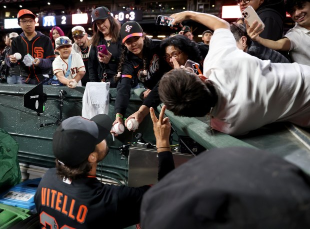 San Francisco Giants manager Tony Vitello signs autographs for fans after their MLB win against the Sultanes de Monterrey at Oracle Park in San Francisco, Calif., on Monday, March 23, 2026. (Jane Tyska/Bay Area News Group)