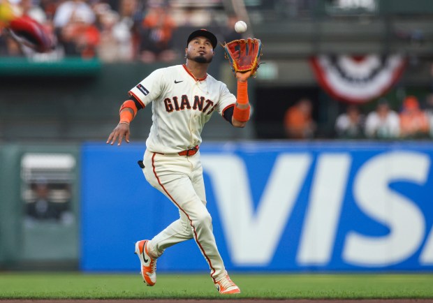 San Francisco Giants' Luis Arraez (1) catches a fly ball against the New York Yankees in the fifth inning during Opening Night at Oracle Park in San Francisco, Calif., on Wednesday, March 25, 2026.  (Shae Hammond/Bay Area News Group)