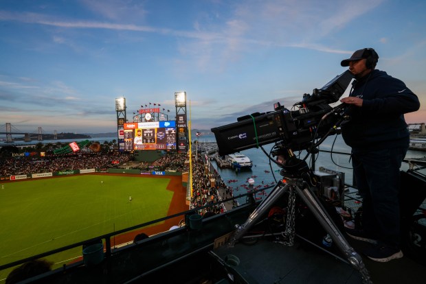 A Netflix camera man focus on the opening night MLB game between the San Francisco Giants and the New York Yankees at Oracle Park in San Francisco, Calif., on Wednesday, March 25, 2026. (Ray Chavez/Bay Area News Group)