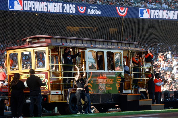 Fans cheer from a cable car on the field during Opening Night at Oracle Park in San Francisco, Calif., on Wednesday, March 25, 2026.  (Shae Hammond/Bay Area News Group)