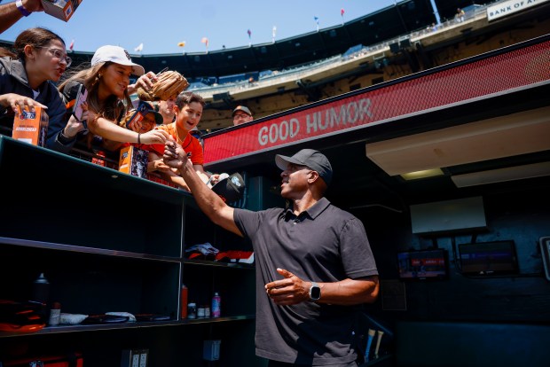 Form San Francisco Giants' Barry Bonds signs autographs before a game against the Los Angeles Dodgers at Oracle Park in San Francisco, Calif., on Saturday, July 12, 2025. (Shae Hammond/Bay Area News Group)