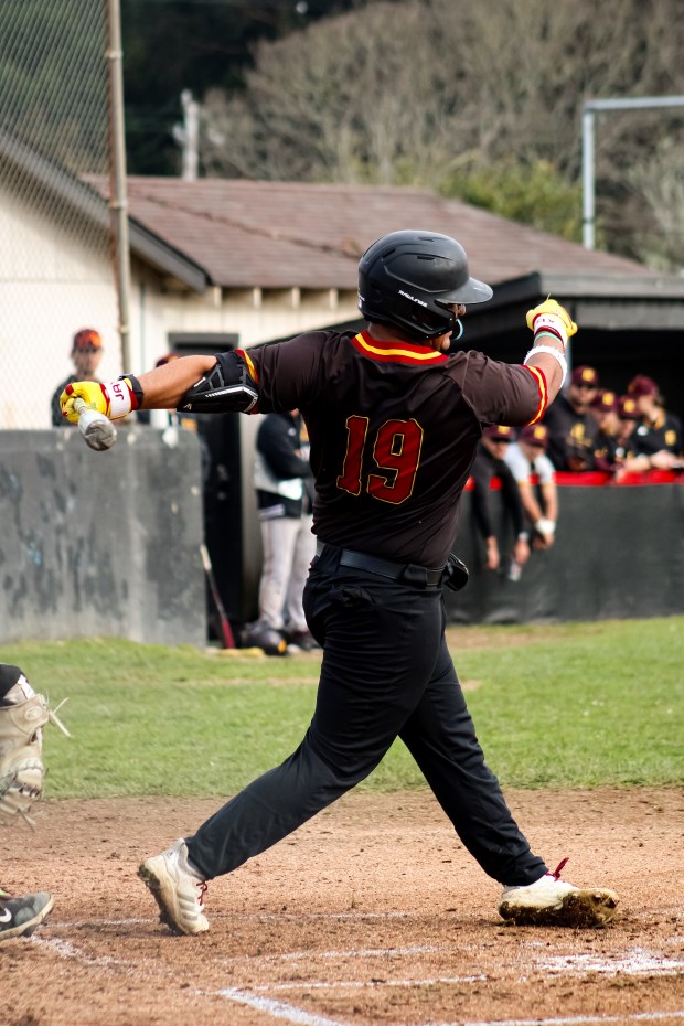 Javier Mesa follows through with his swing. (Quick Flics by Jackson)