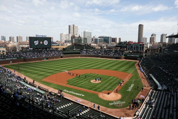 The grounds crew works on the field before the Chicago Cubs play their game against the Washington Nationals at Wrigley Field on Sunday, March 29, 2026. (Eileen T. Meslar/Chicago Tribune)