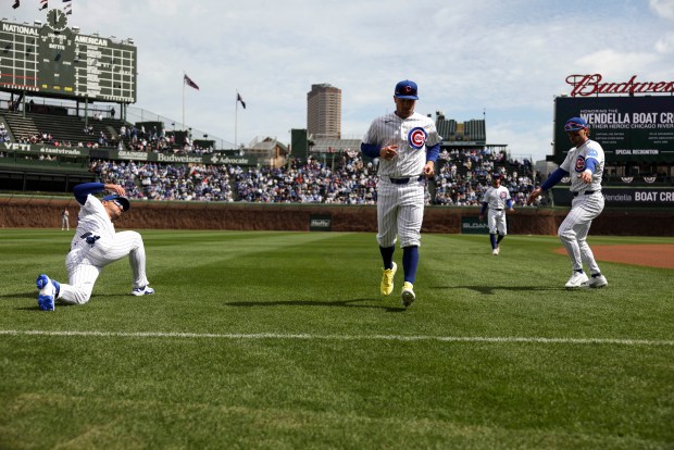 Chicago Cubs players warm up before their game against the Washington Nationals at Wrigley Field on Sunday, March 29, 2026. (Eileen T. Meslar/Chicago Tribune)