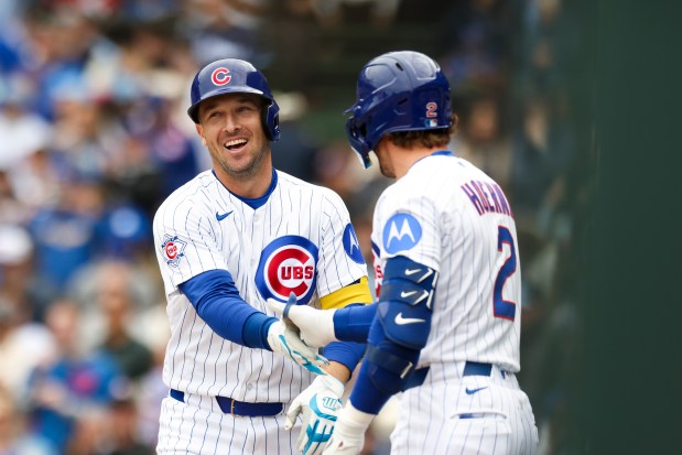 Chicago Cubs third baseman Alex Bregman (3) celebrates with second baseman Nico Hoerner (2) after hitting a home run during the fourth inning against the Washington Nationals at Wrigley Field on Sunday, March 29, 2026. (Eileen T. Meslar/Chicago Tribune)
