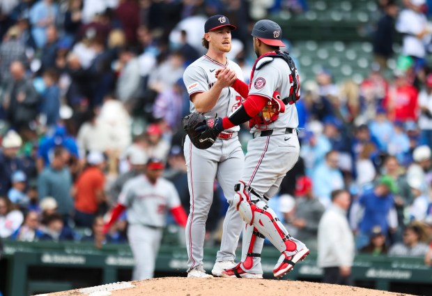 Washington Nationals pitcher Clayton Beeter (39) celebrates with catcher Keibert Ruiz (20) after the Nationals defeated the Chicago Cubs 6-3 at Wrigley Field on Sunday, March 29, 2026. (Eileen T. Meslar/Chicago Tribune)