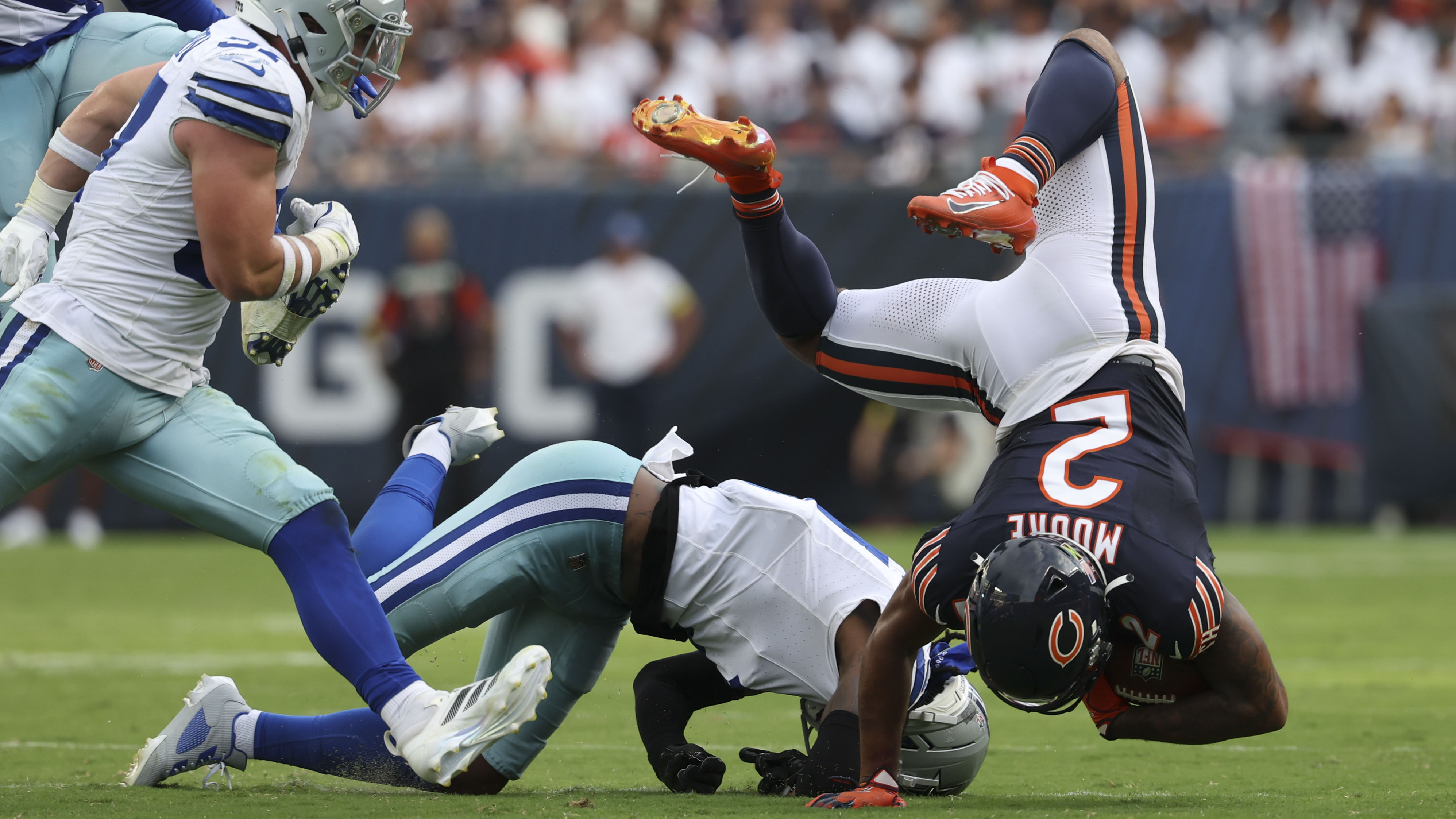 Chicago Bears wide receiver DJ Moore (2) tumbles after making...