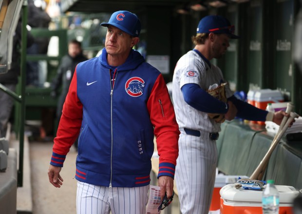 Chicago Cubs manager Craig Counsell and second baseman Nico Hoerner leave the dugout after a 10-4 loss to the Washington Nationals on opening day Thursday, March 26, 2026, at Wrigley Field. (Brian Cassella/Chicago Tribune)