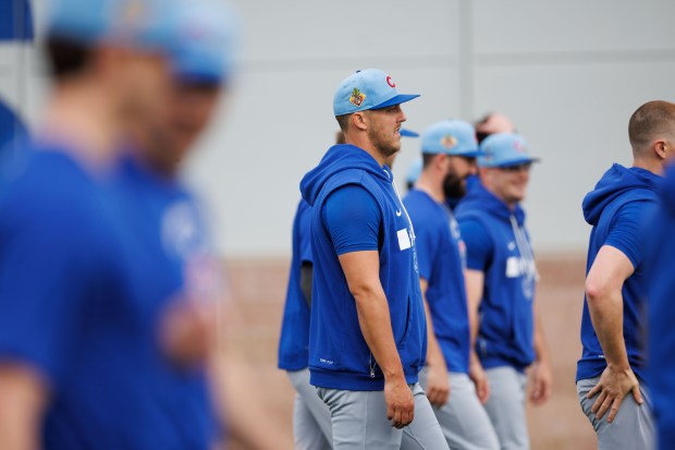 Jameson Taillon warms up with other Cubs pitchers during the first day of full-squad workout at spring training on Feb. 16, 2026, at Sloan Park in Mesa, Ariz. (Armando L. Sanchez/Chicago Tribune)