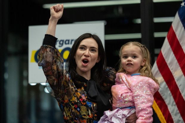 State Rep. Margaret Croke celebrates her lead in the race to be the Democratic nominee for comptroller with her daughter, Pattie Croke, 2, in Chicago's West Loop neighborhood on March 17, 2026. (Josh Boland/Chicago Tribune)