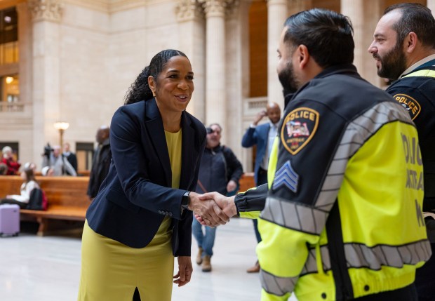 Lt. Gov. Juliana Stratton, the Democratic nominee for U.S. Senate, greets Amtrak police while thanking voters March 18, 2026, at the Great Hall in Union Station the morning after winning her primary election. (Brian Cassella/Chicago Tribune)