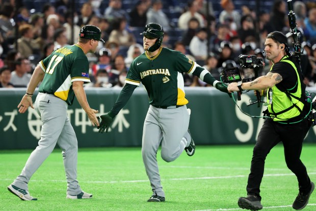 Australia's Curtis Mead celebrates with coach Andrew Graham after hitting a three-run home run in the third inning against and Czechia at Tokyo Dome on March 6, 2026, in Tokyo, Japan. (Photo by Chung Sung-Jun/Getty Images)