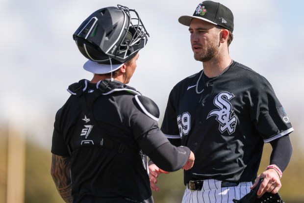 White Sox pitcher Sean Burke speaks to catcher Korey Lee during spring training at Camelback Ranch on Tuesday, Feb. 17, 2026, in Glendale, Ariz. (Eileen T. Meslar/Chicago Tribune)