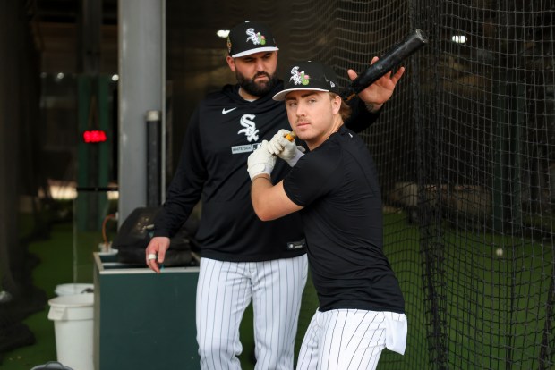 A Chicago White Sox hitting coach works with infielder Chase Meidroth during spring training at Camelback Ranch in Glendale, Ariz., on Wednesday, Feb. 18, 2026. (Eileen T. Meslar/Chicago Tribune)