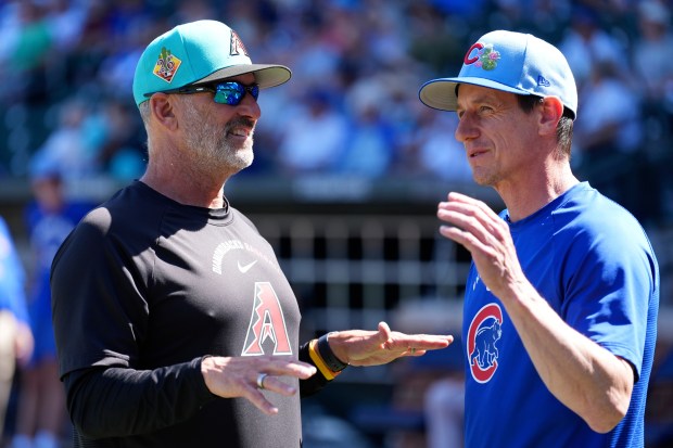 Cubs manager Craig Counsell, right, talks with Diamondbacks manager Torey Lovullo before a Cactus League game Thursday, March 5, 2026, in Mesa, Ariz. (Ross D. Franklin/AP)