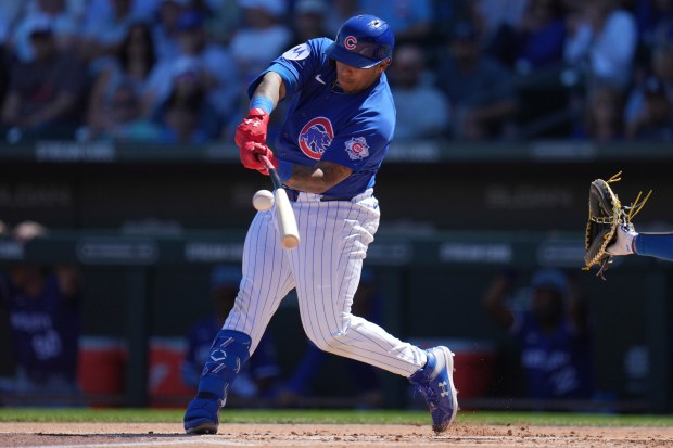 Chicago Cubs' Moisés Ballesteros makes contact with the ball during the first inning of a spring training baseball game against the Kansas City Royals, Wednesday, March 11, 2026, in Mesa, Ariz. (AP Photo/Ross D. Franklin)