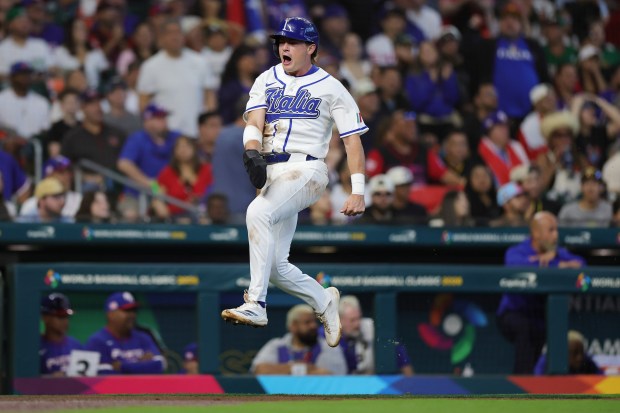 Italy's Sam Antonacci celebrates while scoring a run against Puerto Rico in the first inning of a World Baseball Classic game at Daikin Park on March 14, 2026, in Houston. (Alex Slitz/Getty)