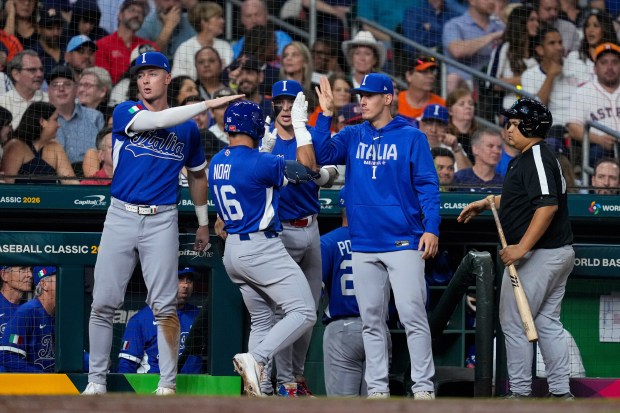 Italy outfielder Dante Nori (16) celebrates with teammates after hitting a sacrifice fly during a World Baseball Classic game against Team USA on Tuesday, March 10, 2026, in Houston. (Ashley Landis/AP)
