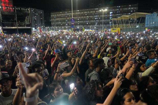 Venezuela fans celebrate their country's win against the United States in the championship game of the World Baseball Classic on Wednesday, March 18, 2026, in Caracas, Venezuela. (Ariana Cubillos/AP)