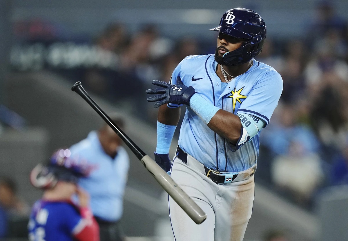 Tampa Bay Rays' Junior Caminero (13) celebrates his grand slam against the Toronto Blue Jays during ninth inning MLB baseball action in Toronto on Tuesday, May 13, 2025. (Nathan Denette/The Canadian Press via AP)