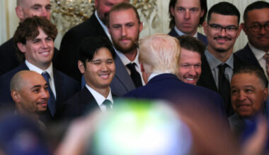 April 7, 2025; Washington, D.C., USA; President Donald Trump speaks with Los Angeles Dodgers designated hitter Shohei Ohtani during a ceremony honoring the members of the 2024 World Series Champion Los Angeles Dodgers in the East Room at the White House. Mandatory Credit: Leah Millis/Reuters via Imagn Images