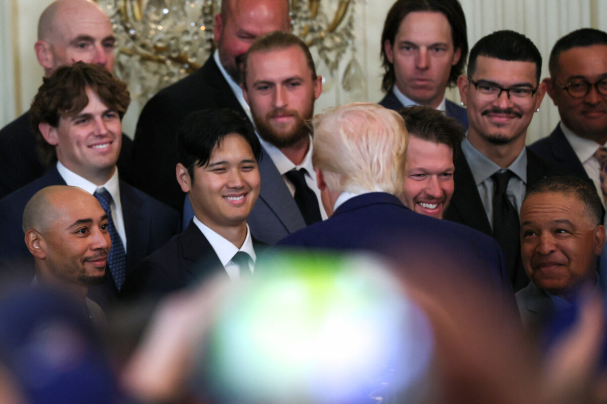 April 7, 2025; Washington, D.C., USA; President Donald Trump speaks with Los Angeles Dodgers designated hitter Shohei Ohtani during a ceremony honoring the members of the 2024 World Series Champion Los Angeles Dodgers in the East Room at the White House. Mandatory Credit: Leah Millis/Reuters via Imagn Images