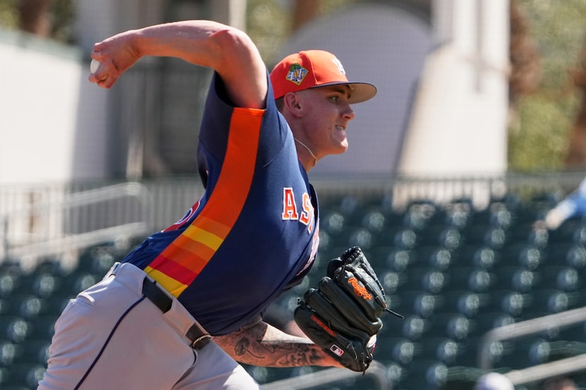 Houston Astros starting pitcher Hunter Brown throws during the first inning of a spring...