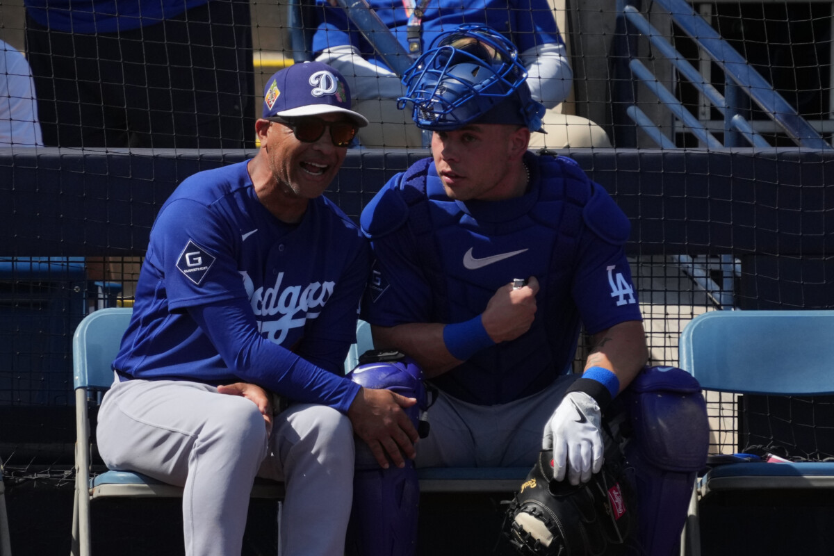 Los Angeles Dodgers manager Dave Roberts (30) and catcher Dalton Rushing (68) talk in the second inning against the Milwaukee Brewers at American Family Fields of Phoenix.