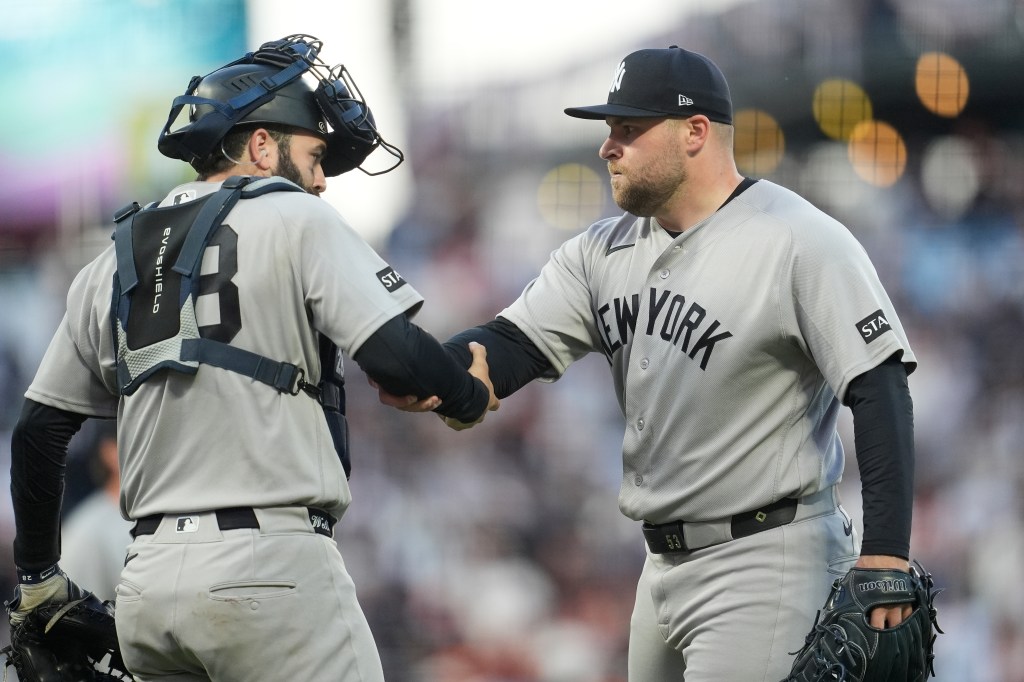 Austin Wells (left) celebrates with closer David Bednar after the Yankees' 3-1 win over the Giants at Oracle Park on March 28, 2026 in San Francisco.
