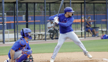 New York Mets catcher Austin Barnes (55) takes batting practice as catcher Ben Rortvedt (left) waits on the pitch during spring training workouts at Clover Park.