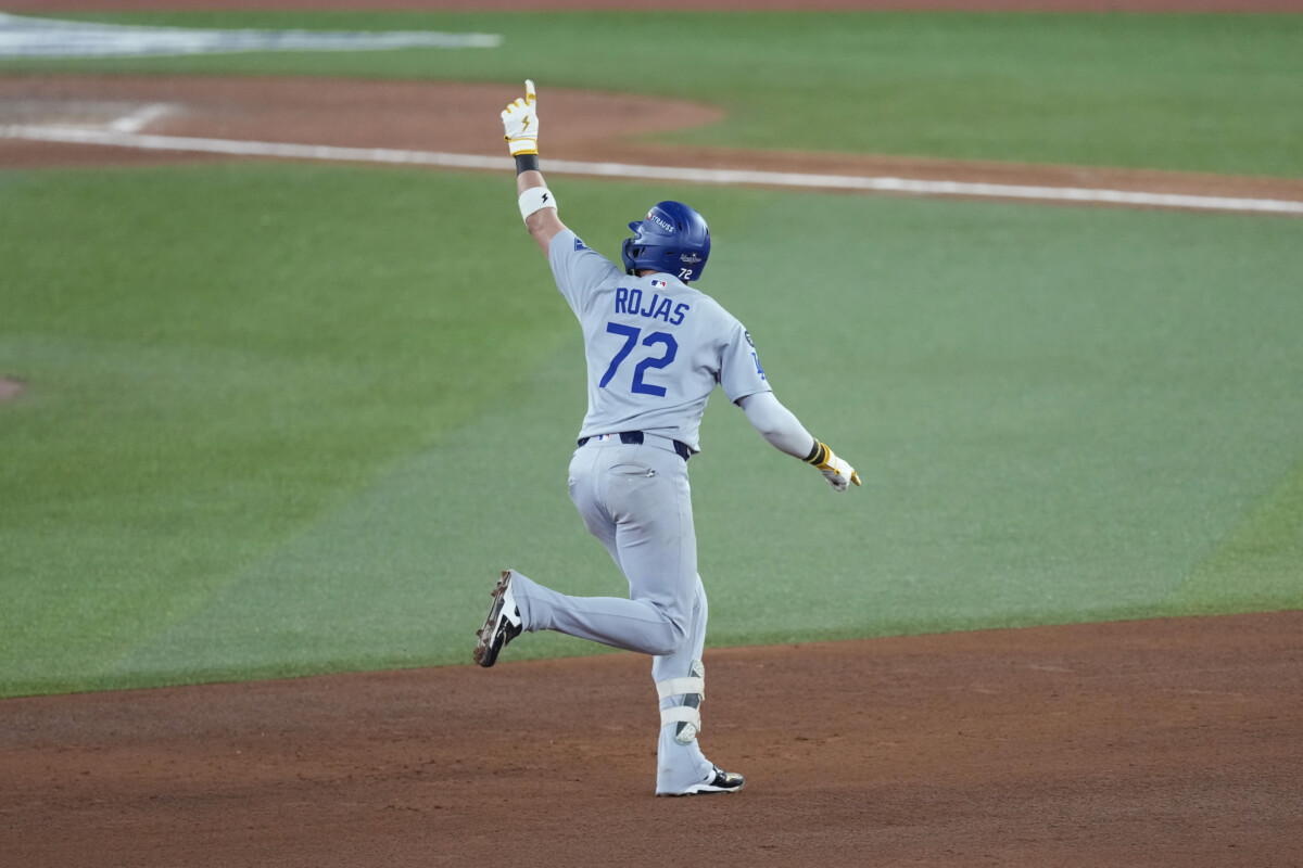 Los Angeles Dodgers second baseman Miguel Rojas (72) celebrates as he runs the bases after hitting a home run against the Toronto Blue Jays in the ninth inning during game seven of the 2025 MLB World Series at Rogers Centre.