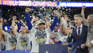 Los Angeles Dodgers manager Dave Roberts (30) celebrates on the podium during the post game celebration after defeating the Toronto Blue Jays in the 2025 MLB World Series at Rogers Centre.