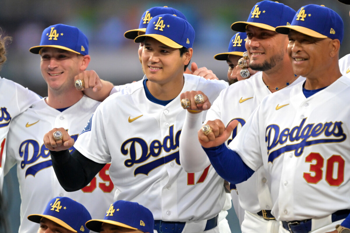 Mar 27, 2026; Los Angeles, California, USA; Los Angeles Dodgers two-way player Shohei Ohtani (17) and the team pose for a photo showing their World Series rings during a ceremony prior to the game against the Arizona Diamondbacks at Dodger Stadium. Mandatory Credit: Jayne Kamin-Oncea-Imagn Images