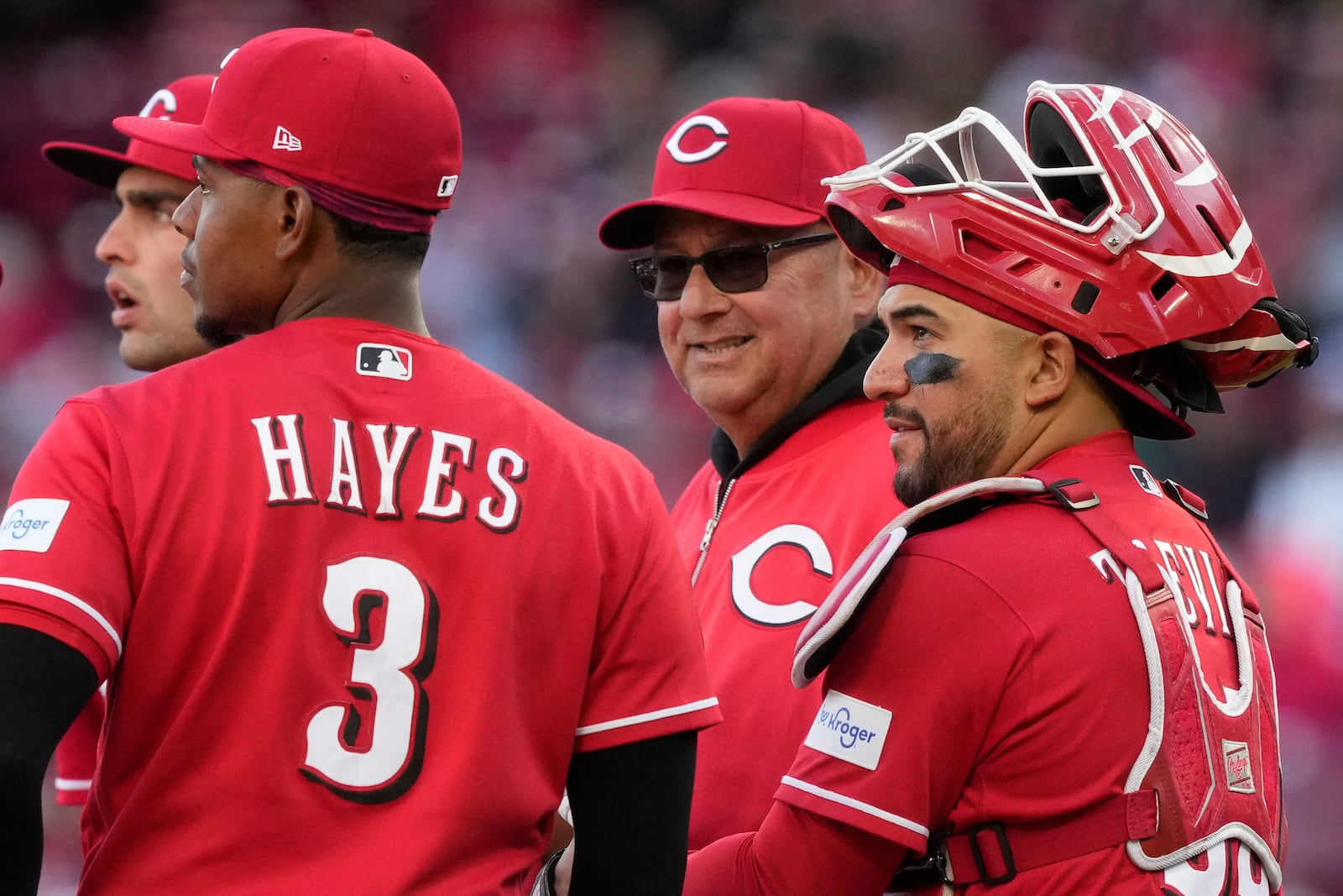 Cincinnati Reds manager Terry Francona, center, stands on the mound with third baseman Ke'bryan Hayes, left, and catcher Jose Trevino, right, during pitching change during the seventh inning of a baseball game against the Boston Red Sox in Cincinnati, Saturday, March 28, 2026. (AP Photo/Carolyn Kaster)