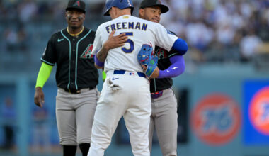 Mar 28, 2026; Los Angeles, California, USA; Arizona Diamondbacks second baseman Ketel Marte (4) hugs Los Angeles Dodgers first baseman Freddie Freeman (5) after tagging him out on a fielders choice during the second inning at Dodger Stadium. Mandatory Credit: Jayne Kamin-Oncea-Imagn Images