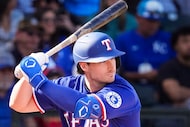 Texas Rangers infielder Justin Foscue bats during the seventh inning of a spring training...