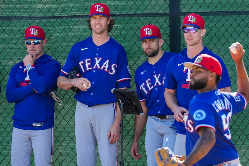 From left, Texas Rangers manager Skip Schumaker, pitcher Jacob Degrom, pitcher Nathan...