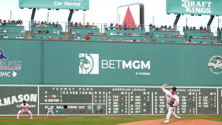 Fenway Park with Red Sox pitcher throwing in front of the Green Monster