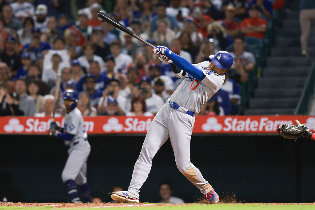 MLB player hitting during game representing player props and betting markets on DraftKings